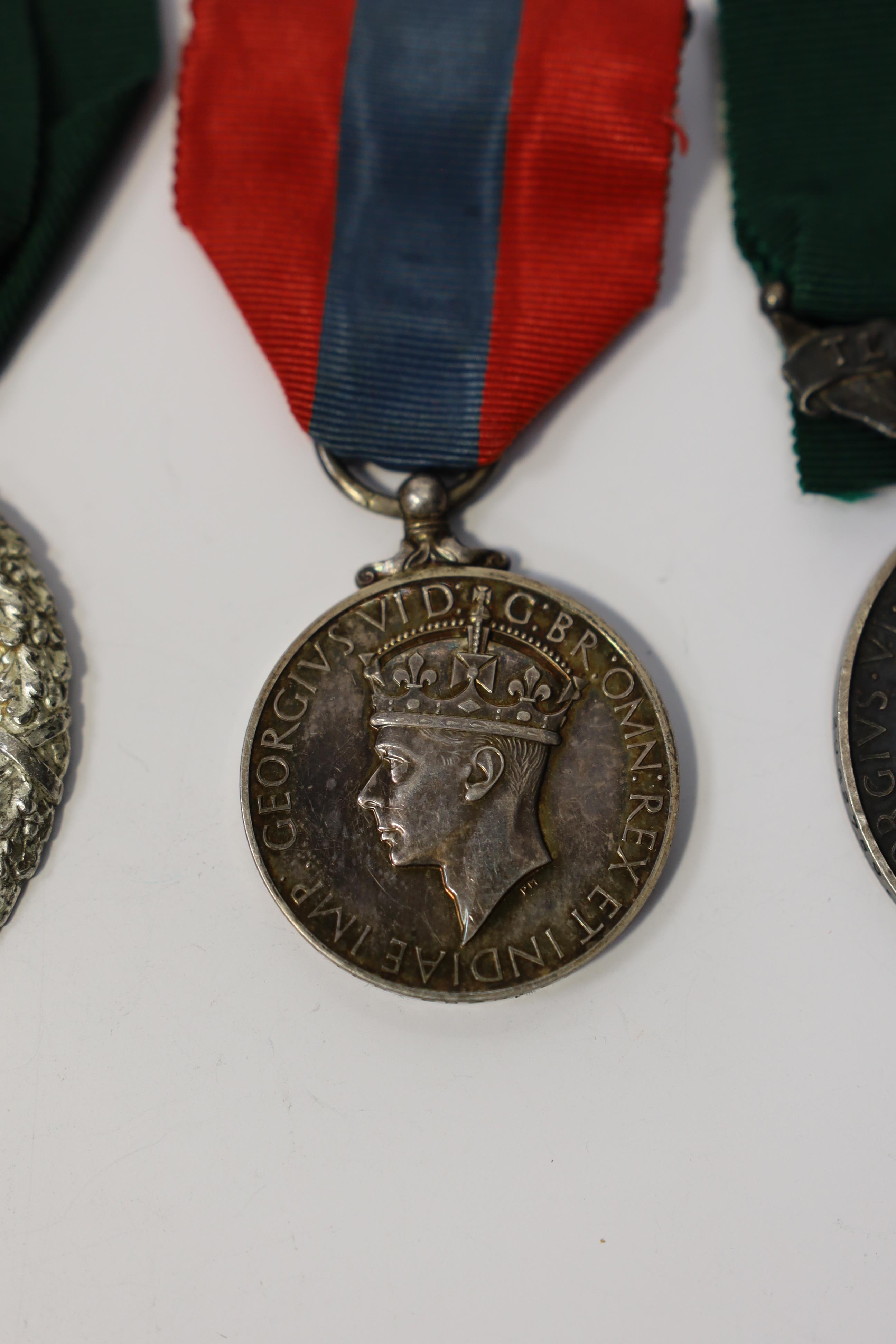 Three assorted service medals; Ed VII Volunteer Officer's Decoration hallmarked for 1905; GV Imperial Service medal to Walter Charles Cornish; GVI Territorial Efficiency medal to 2062789 . S/Sgt. L.W.Sergeant. R.A. Condi